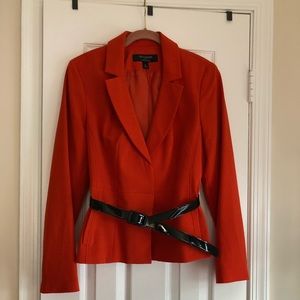 Stunning orange skirt suit.